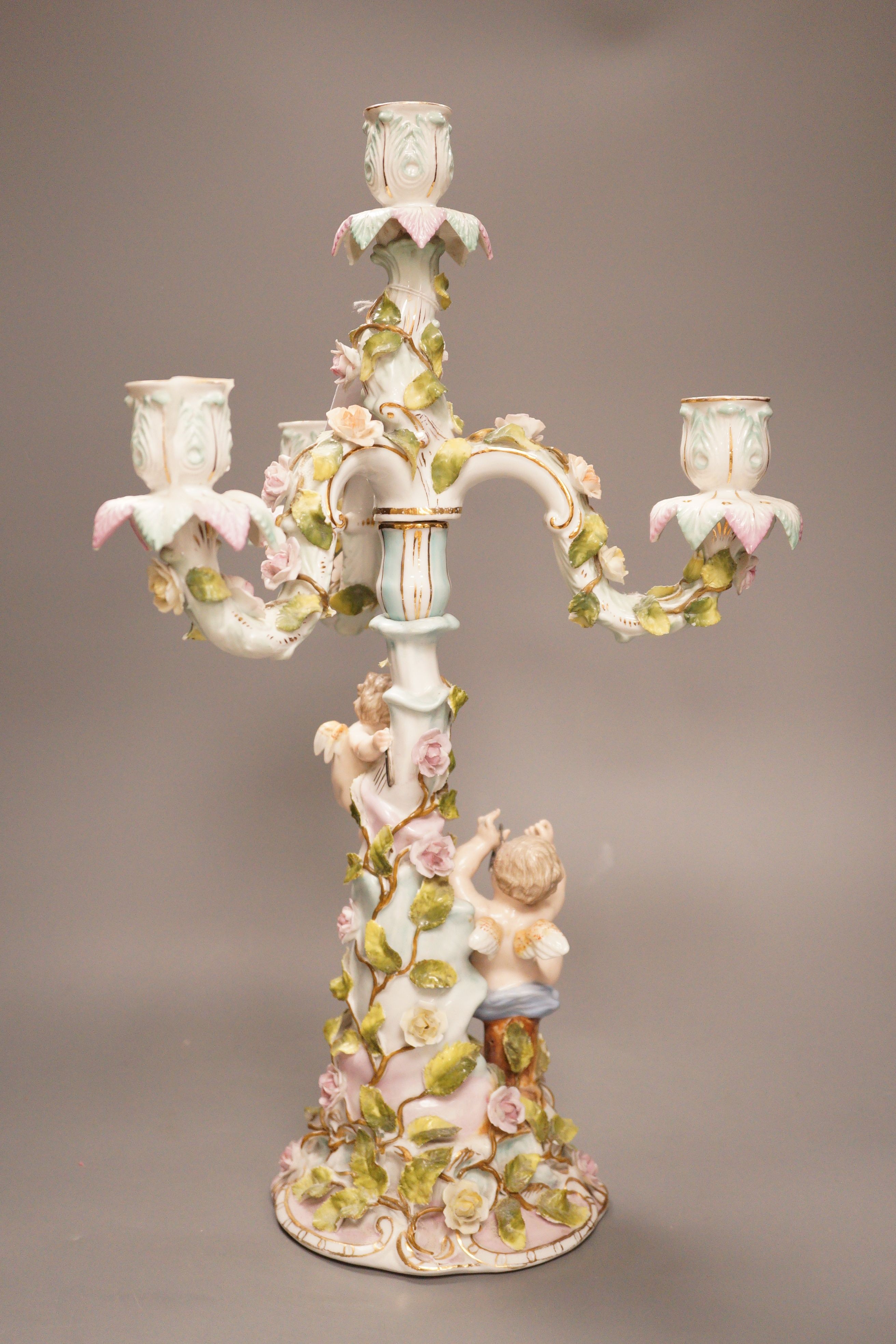 A Sitzendorf porcelain three branch, four light candelabrum, 45cm